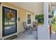 Charming front porch with comfortable seating and decorative hanging plants at 606 Knowledge Dr, Ladson, SC 29456