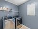 Functional laundry room with modern washer and dryer units, and a window at 606 Knowledge Dr, Ladson, SC 29456