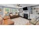 Cozy living room with fireplace, built-in shelves, and comfortable seating at 606 Knowledge Dr, Ladson, SC 29456