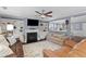 Comfortable living room features a fireplace, built-in shelving, ceiling fan and an area rug at 606 Knowledge Dr, Ladson, SC 29456