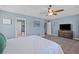A serene main bedroom with neutral tones, featuring a ceiling fan and ample space at 606 Knowledge Dr, Ladson, SC 29456