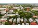 An aerial view of a historic neighborhood featuring colorful buildings and abundant green trees at 62 Society St, Charleston, SC 29401