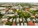 An aerial view of a historic neighborhood with colorful buildings and lush green trees at 62 Society St, Charleston, SC 29401