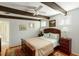 Comfortable bedroom with a ceiling fan, natural light, and wood floors at 62 Society St, Charleston, SC 29401