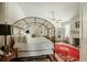 Bedroom featuring a four-poster bed, fireplace, and hardwood floors at 62 Society St, Charleston, SC 29401