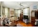 Bedroom with neutral paint, wood floors, a ceiling fan, and bright windows at 62 Society St, Charleston, SC 29401