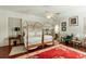 Cozy bedroom featuring a four-poster bed, ceiling fan, and area rug at 62 Society St, Charleston, SC 29401