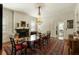 Traditional dining room with chandelier, fireplace, and hardwood floors at 62 Society St, Charleston, SC 29401