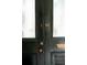 Stylish black front door with a glass panel and ornate details at 62 Society St, Charleston, SC 29401