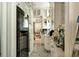 Galley kitchen with white cabinets, subway tile backsplash, and bright light throughout at 62 Society St, Charleston, SC 29401