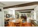 Inviting living room with wood beams, hardwood floors, and plentiful natural light at 62 Society St, Charleston, SC 29401