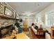 Cozy living room featuring a brick fireplace and comfortable seating at 62 Society St, Charleston, SC 29401