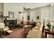 Spacious living room with a fireplace, built-in shelves, and lots of natural light at 62 Society St, Charleston, SC 29401