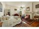Bright main bedroom with fireplace, wood floors, and ensuite closet at 62 Society St, Charleston, SC 29401