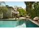This in-ground pool offers ultimate privacy surrounded by mature landscaping and conveniently located near the main house at 62 Society St, Charleston, SC 29401