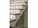 Close-up of a staircase with white risers and decorative details at 62 Society St, Charleston, SC 29401