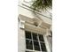 Close-up of the building's detailed window, showcasing its classic architectural elements at 62 Society St, Charleston, SC 29401