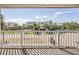 Balcony view showcases a charming neighborhood with palm trees and well-maintained homes at 625 Ocean Blvd, Isle of Palms, SC 29451
