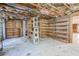 Unfinished basement featuring open ceilings with exposed pipes and a shelving unit at 625 Ocean Blvd, Isle of Palms, SC 29451