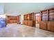 Large basement with built-in wooden shelving and cabinets, offering ample storage and potential at 625 Ocean Blvd, Isle of Palms, SC 29451