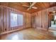 Bright bedroom features wood paneling, hardwood floors, and natural light at 625 Ocean Blvd, Isle of Palms, SC 29451