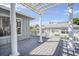 View of a deck with a pergola featuring white columns at 625 Ocean Blvd, Isle of Palms, SC 29451