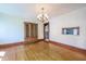 Elegant dining room with hardwood floors and decorative chandelier at 625 Ocean Blvd, Isle of Palms, SC 29451