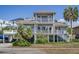 Charming two-story home showcasing multiple balconies and covered parking for vehicles and boats at 625 Ocean Blvd, Isle of Palms, SC 29451
