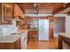 Well-equipped kitchen with wood-beamed ceiling, white appliances, and ample storage at 625 Ocean Blvd, Isle of Palms, SC 29451