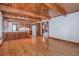 Eat-in kitchen featuring wood cabinets, hardwood floors, and an open transition to the dining area at 625 Ocean Blvd, Isle of Palms, SC 29451
