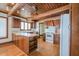 Charming kitchen with wood-beamed ceiling, hardwood floors, and ample counter space at 625 Ocean Blvd, Isle of Palms, SC 29451