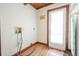 Simple laundry room with white walls, wooden floors, and utility connections, ready for appliances at 625 Ocean Blvd, Isle of Palms, SC 29451