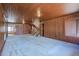 Spacious living area featuring classic wood paneling, carpet floors, staircase, and a bright atmosphere at 625 Ocean Blvd, Isle of Palms, SC 29451