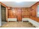 View of a mud room with wood paneling and a small built-in bench at 625 Ocean Blvd, Isle of Palms, SC 29451