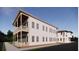 Two-story home with double porch, complemented by the adjacent building at 63 Montagu St, Charleston, SC 29401