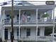 Two-story white home with double balconies and classic architectural details at 63 Montagu St, Charleston, SC 29401