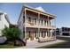 Inviting two-story home with a double porch, ideal for relaxation and curb appeal at 63 Montagu St, Charleston, SC 29401