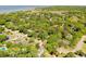 Scenic aerial view of a neighborhood nestled among lush greenery near the coast at 699 Castle Pinckney Dr, James Island, SC 29412