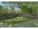 Backyard putting green with multiple flags in well-maintained, grassy lawn and a fence at 699 Castle Pinckney Dr, James Island, SC 29412