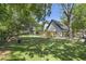 Large backyard with putting green and swimming pool. Large shade tree in the yard at 699 Castle Pinckney Dr, James Island, SC 29412