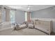Bedroom design in neutral grey tones with modern white trim and accents at 699 Castle Pinckney Dr, James Island, SC 29412