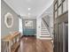 A welcoming foyer features hardwood floors, elegant trim, and a staircase at 699 Castle Pinckney Dr, James Island, SC 29412