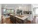 An open concept kitchen featuring stainless steel appliances and a large island at 699 Castle Pinckney Dr, James Island, SC 29412