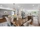 A well-lit kitchen with white cabinetry and a stainless steel refrigerator at 699 Castle Pinckney Dr, James Island, SC 29412