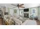 A cozy living room with a fireplace and a comfortable sectional sofa at 699 Castle Pinckney Dr, James Island, SC 29412