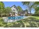 An in-ground pool sits in the backyard of this two story home and additional storage at 699 Castle Pinckney Dr, James Island, SC 29412