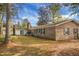 Large brick home with a big backyard and mature trees at 702 Minus St, Saint George, SC 29477