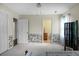 Bright bedroom with patterned wallpaper, tile floors, and closet at 702 Minus St, Saint George, SC 29477