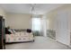 Bedroom with patterned floors, ceiling fan, and closet doors at 702 Minus St, Saint George, SC 29477