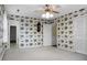 Spacious bedroom featuring floral wallpaper, carpet, and a ceiling fan with light at 702 Minus St, Saint George, SC 29477